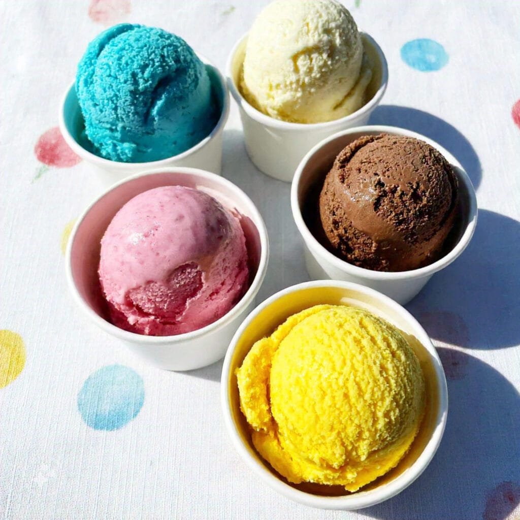 Various flavors of ice cream in colorful bowls