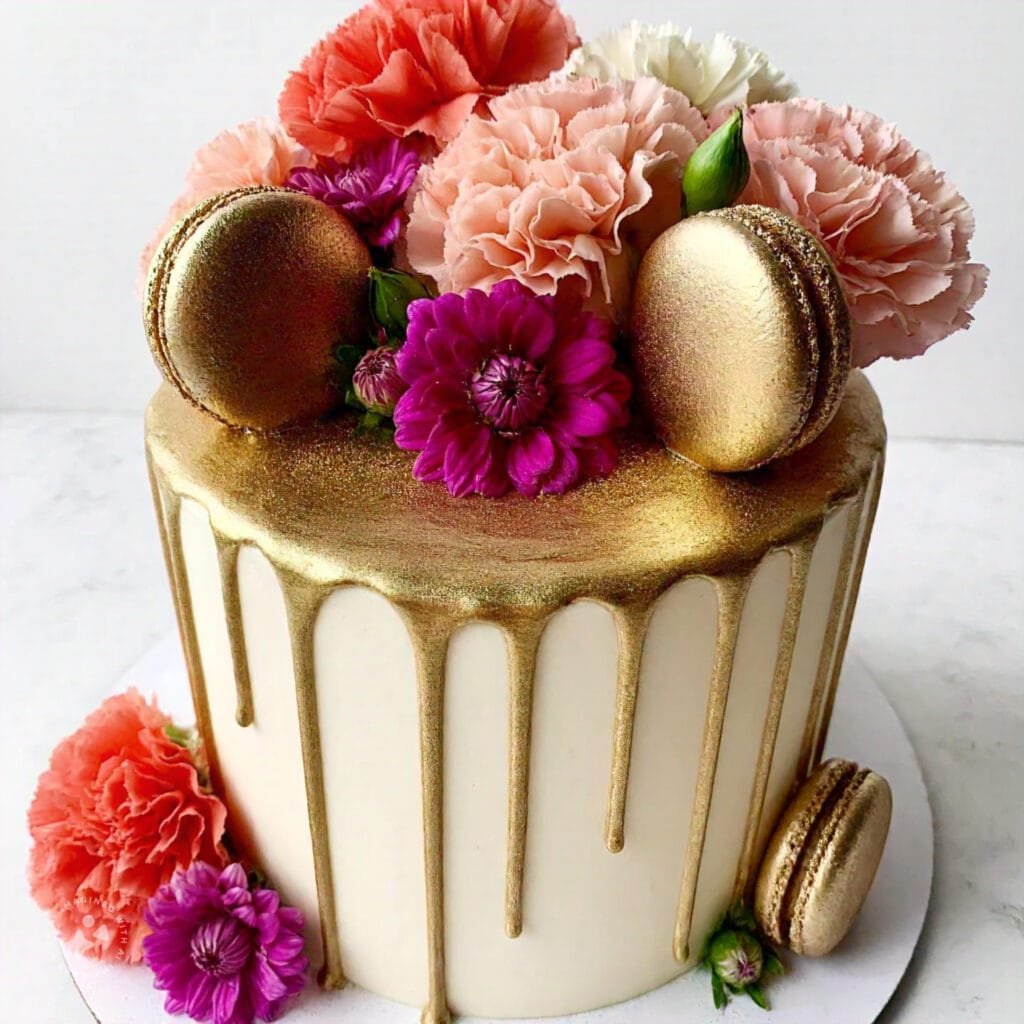 A drip cake with metallic gold ganache