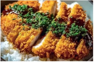 Japanese Katsu Bowls 2 Japanese Katsu Bowl with crispy breaded meat, rice, and rich sauces
